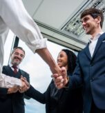 caucasian-businessman-making-a-handshake-together-2025-03-24-23-14-58-utc