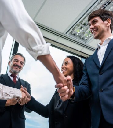 caucasian-businessman-making-a-handshake-together-2025-03-24-23-14-58-utc