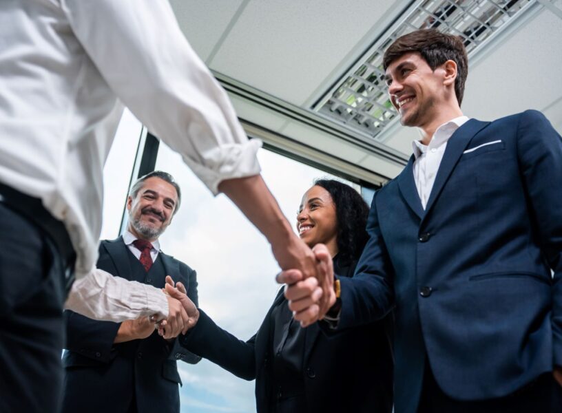 caucasian-businessman-making-a-handshake-together-2025-03-24-23-14-58-utc caucasian-businessman-making-a-handshake-together-2025-03-24-23-14-58-utc